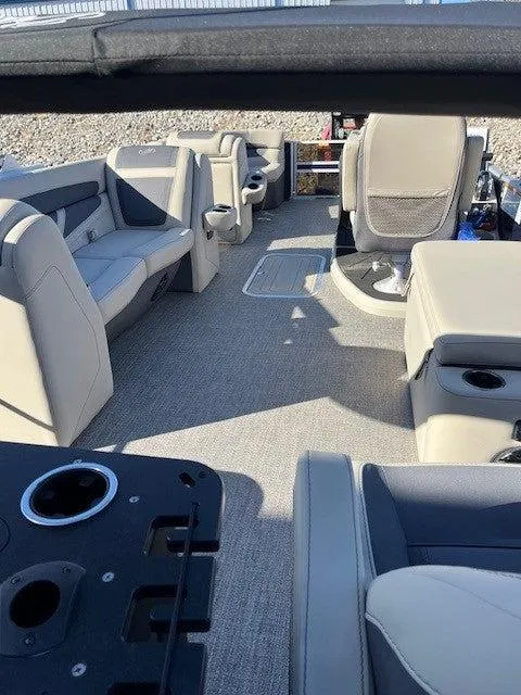 Slide: The Image of 2023 Barletta Cabrio 22CC boat interior with spacious seating and modern design. - 5