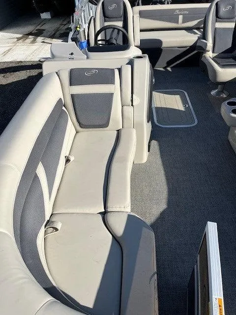 Slide: The Image of 2023 Barletta Cabrio 22UC boat interior with gray seating and carpeted floor. - 4