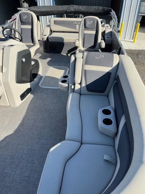 Slide: The Image of 2023 Barletta Cabrio 22UC pontoon boat interior with plush seating and cup holders. - 5