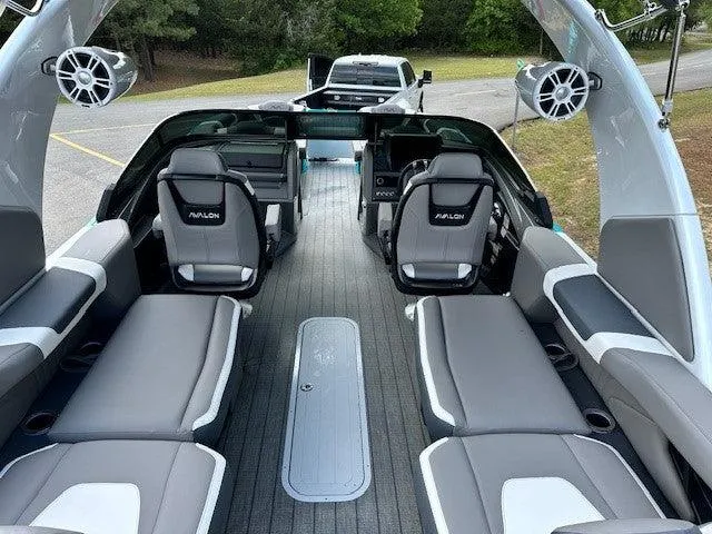 Slide: The Image of 2024 Avalon Quad Lounge Windshield boat interior with sleek seating and modern design. - 2