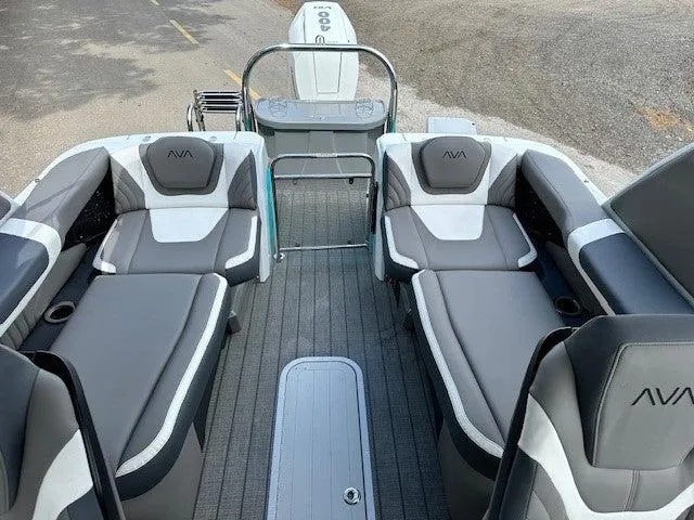 Slide: The Image of 2024 Avalon Quad Lounge Windshield boat interior with gray and white seating. - 3