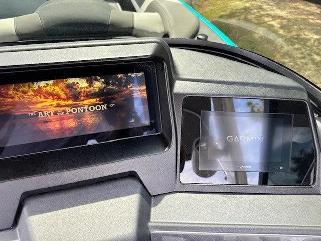 Slide: The Image of 2024 Avalon Quad Lounge Windshield dashboard with dual screens displaying "The Art of Pontoon" and Garmin. - 5