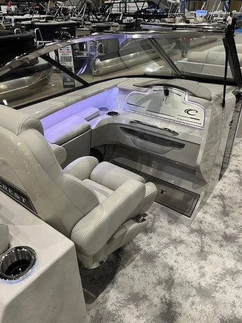 Slide: The Image of 2024 Crest Continental 250 SLRC boat interior with luxurious seating and modern dashboard. - 5