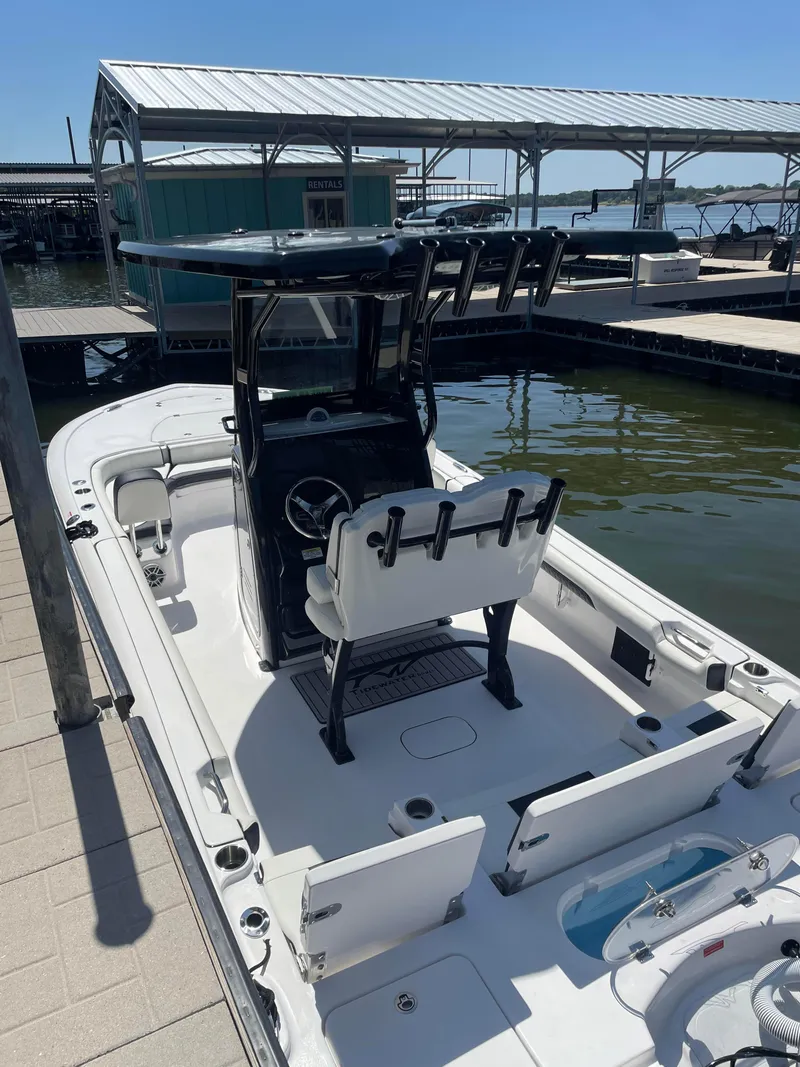 Slide: The Image of 2025 Tidewater Carolina Bay boat docked at a marina under clear skies. - 3