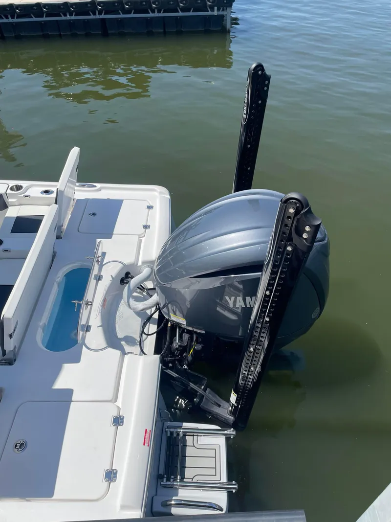 Slide: The Image of 2025 Tidewater Carolina Bay boat with Yamaha outboard motor, docked on calm water. - 4