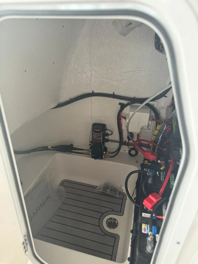 Slide: The Image of 2025 Tidewater 2110 Bay Max boat interior wiring and equipment setup. - 12