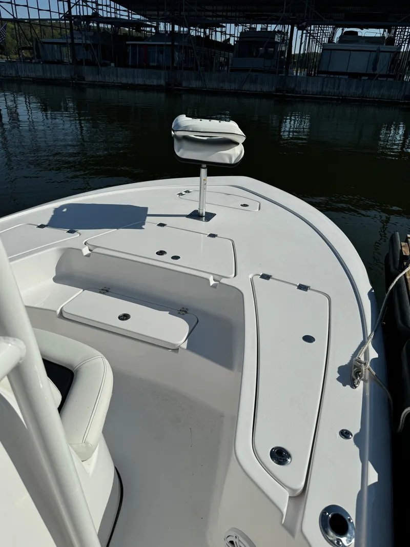 Slide: The Image of 2025 Tidewater 2110 Bay Max boat deck with seating and storage compartments. - 3