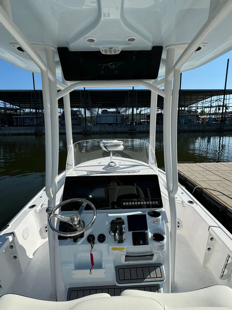 Slide: The Image of 2025 Tidewater 2110 Bay Max boat interior with steering wheel and control panel. - 6