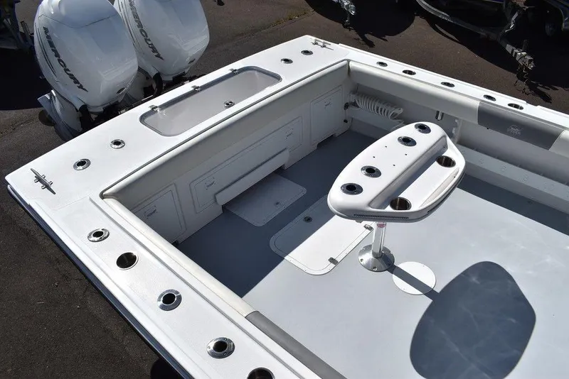 Slide: The Image of 2023 Steiger Craft 31 Miami boat deck with seating and storage compartments. - 19