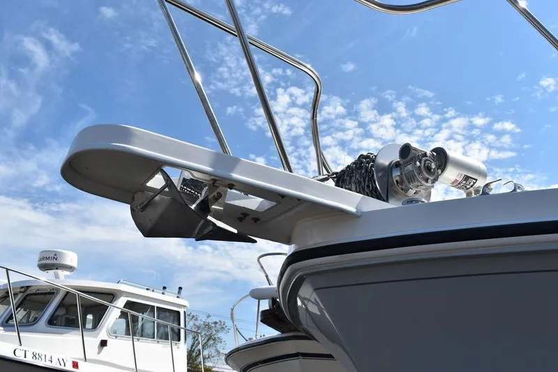 Slide: The Image of 2023 Steiger Craft 31 Miami boat with anchor and winch system under blue sky. - 32