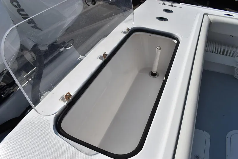 Slide: The Image of 2023 Steiger Craft 31 Miami boat interior with open storage compartment. - 36