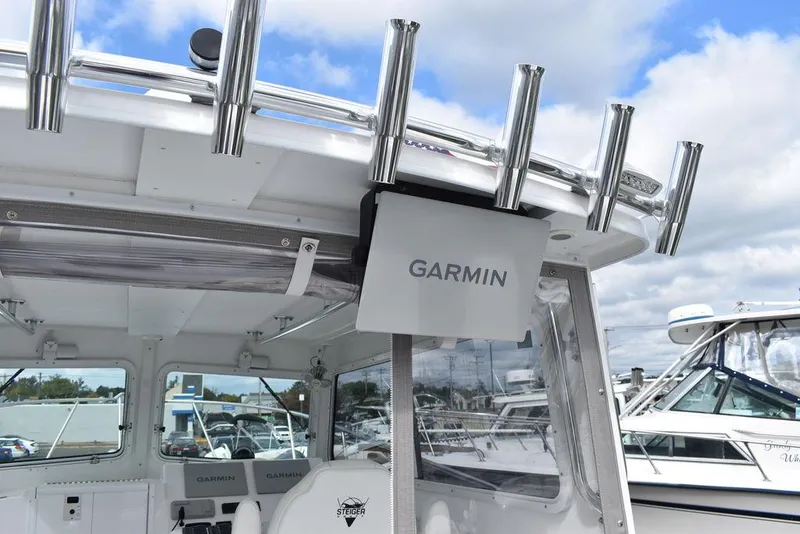 Slide: The Image of 2023 Steiger Craft 31 Miami boat with Garmin electronics and rod holders. - 49