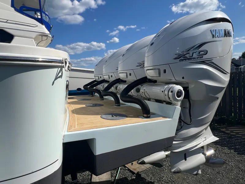Slide: The Image of 2019 Regulator 41 boat with Yamaha XTO outboard engines under a blue sky. - 14
