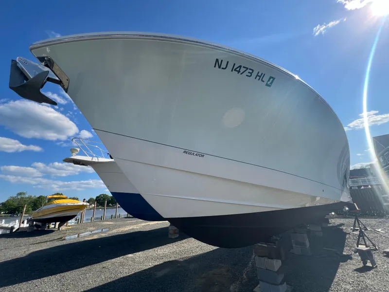 Slide: The Image of 2019 Regulator 41 boat on dry dock under clear blue sky. - 17