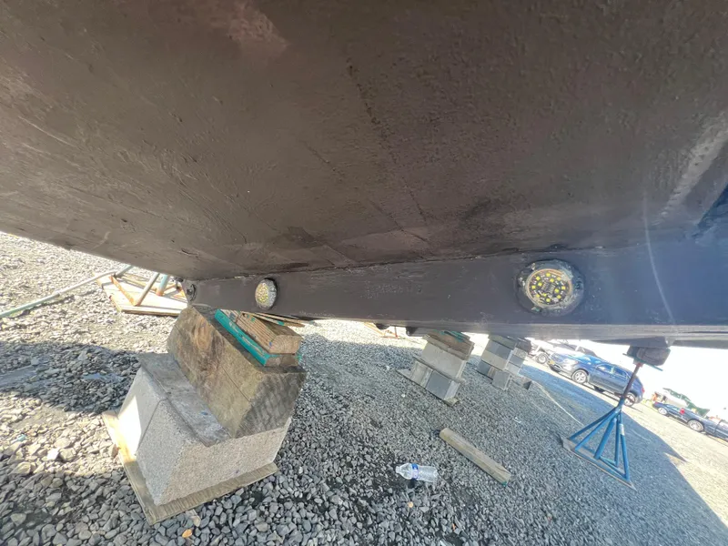 Slide: The Image of Underside of 2019 Regulator 41 boat on blocks, showing hull details. - 19
