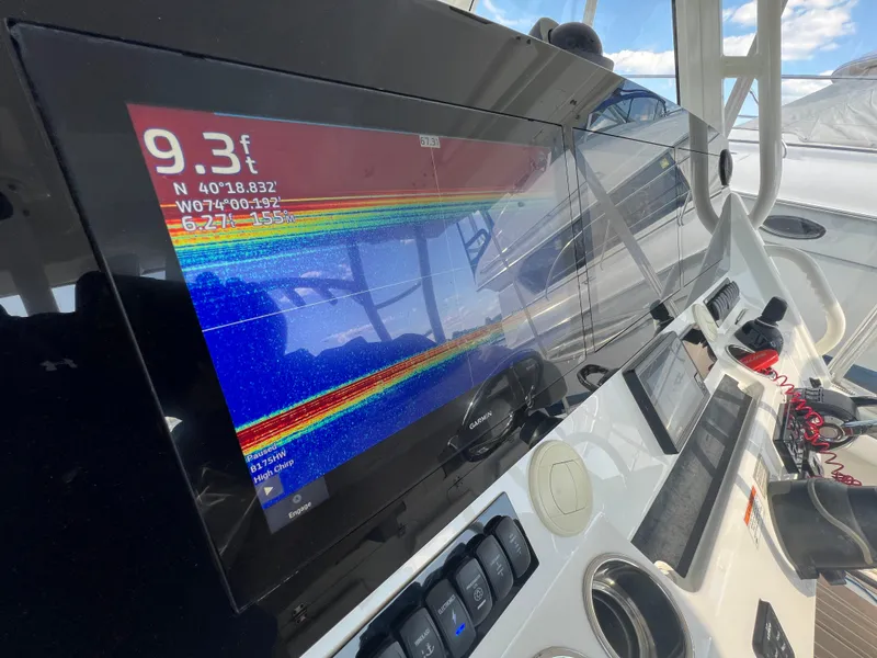 Slide: The Image of 2019 Regulator 41 boat dashboard with navigation and depth display. - 27