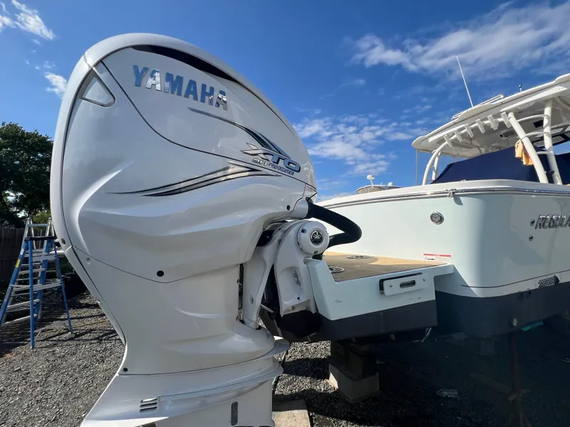 Slide: The Image of 2019 Regulator 41 boat with Yamaha outboard engine under clear blue sky. - 3