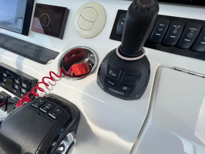 Slide: The Image of Control panel of 2019 Regulator 41 boat with Yamaha joystick and switches. - 31