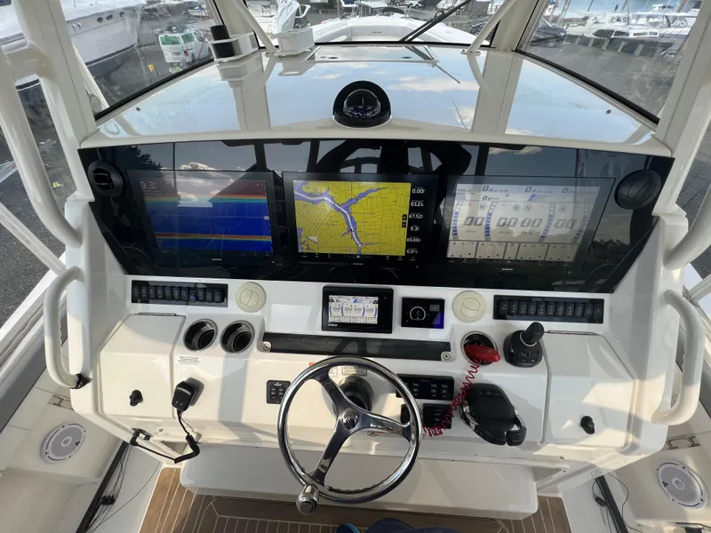 Slide: The Image of 2019 Regulator 41 boat dashboard with advanced navigation and control systems. - 32