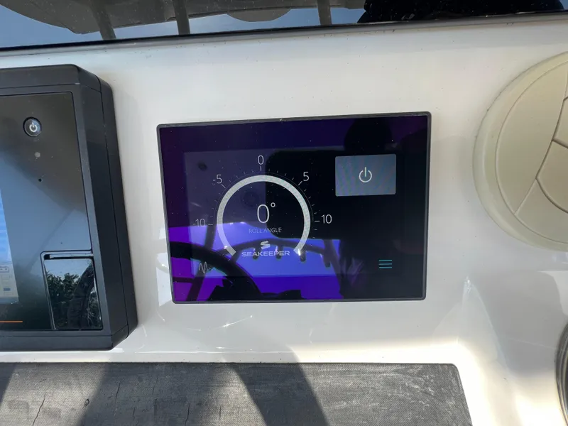 Slide: The Image of Control panel of a 2019 Regulator 41 boat with Seakeeper display. - 33