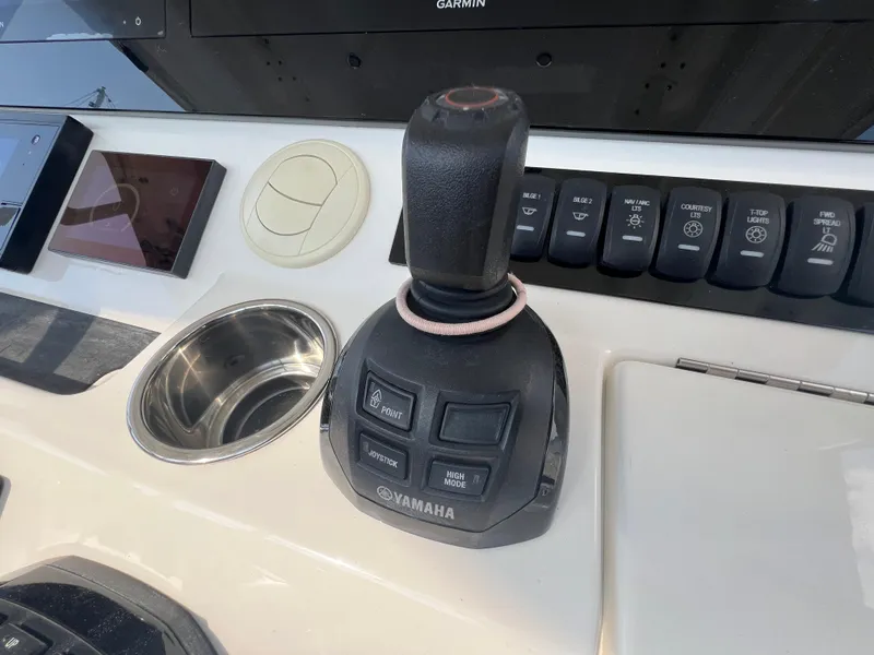 Slide: The Image of Yamaha joystick control on 2019 Regulator 41 boat dashboard. - 35