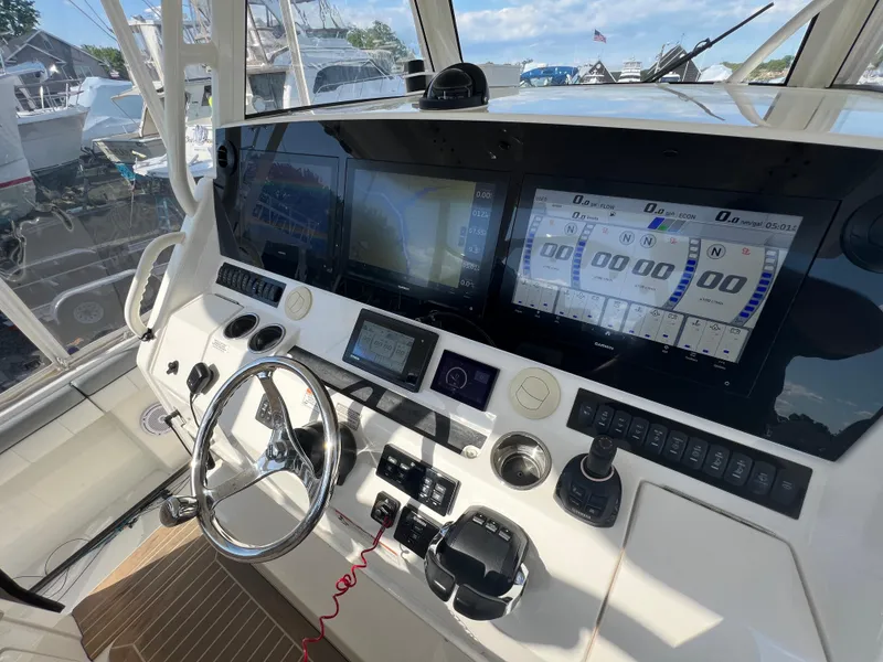 Slide: The Image of 2019 Regulator 41 boat cockpit with advanced navigation and control systems. - 38