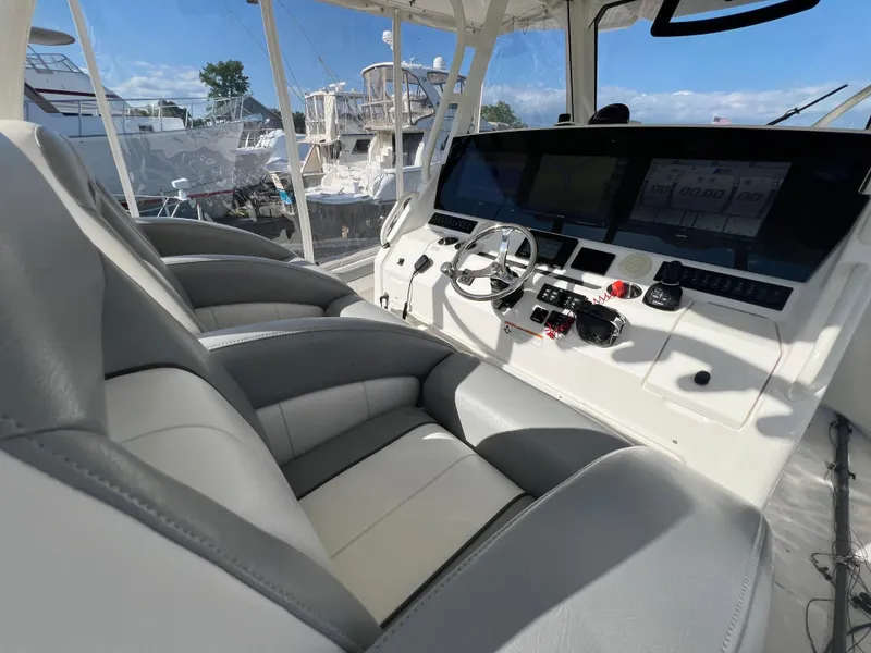 Slide: The Image of 2019 Regulator 41 boat interior with modern helm and seating. - 49