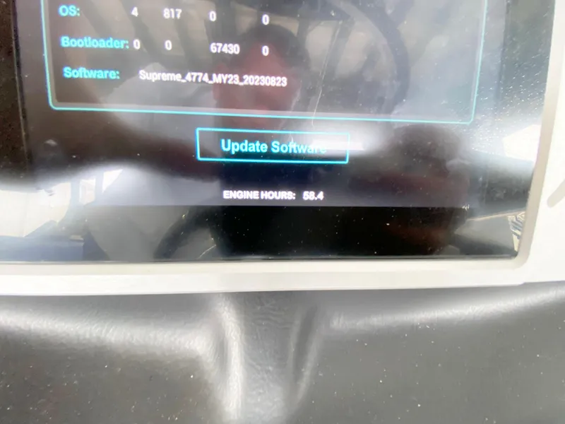 Slide: The Image of Display screen of 2023 Supreme S240 showing software update option and engine hours. - 12