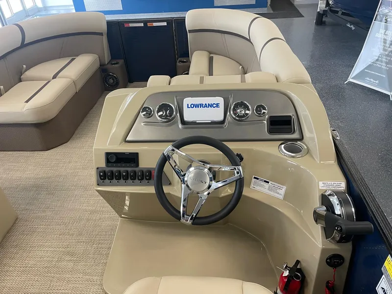 Slide: The Image of 2024 Crest 200L Classic LX boat interior with steering wheel and Lowrance display. - 5