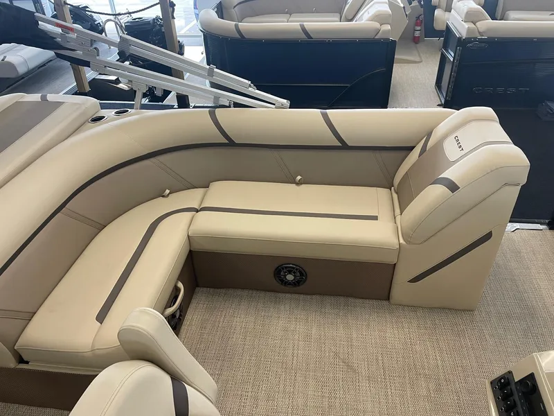 Slide: The Image of 2024 Crest 200L Classic LX boat interior with beige seating and modern design. - 7