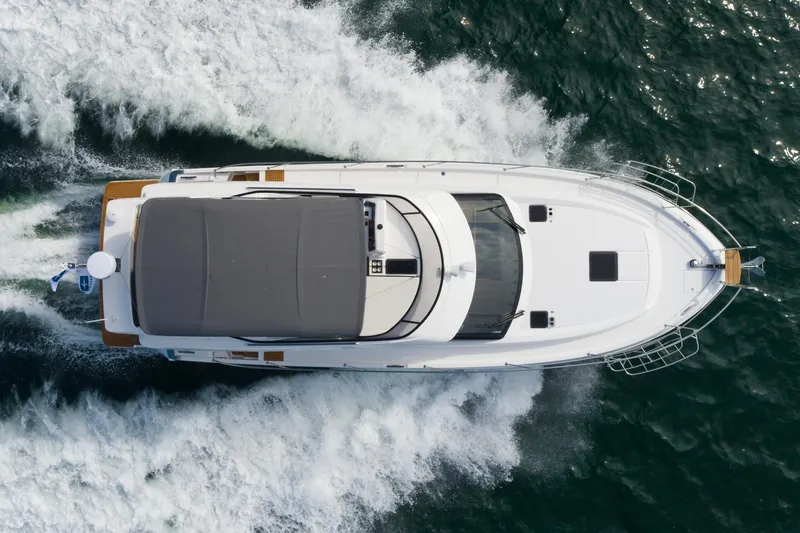 Slide: The Image of Aerial view of 2025 Bavaria Virtess 420 Fly yacht cruising on the ocean. - 10
