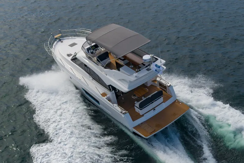 Slide: The Image of 2025 Bavaria Virtess 420 Fly yacht cruising on open water. - 11