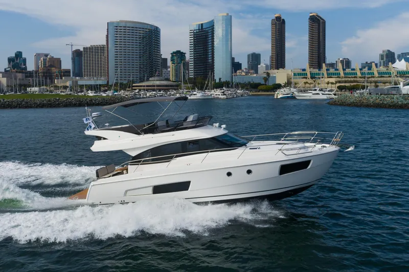 Slide: The Image of 2025 Bavaria Virtess 420 Fly yacht cruising near city skyline. - 12