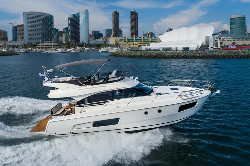 Slide: The Image of 2025 Bavaria Virtess 420 Fly yacht cruising near city skyline. - 13