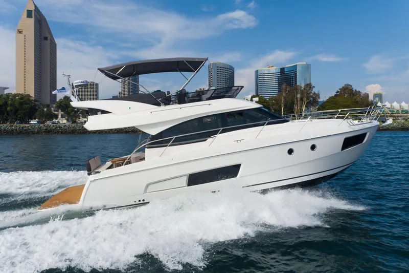 Slide: The Image of 2025 Bavaria Virtess 420 Fly yacht cruising near city skyline. - 15