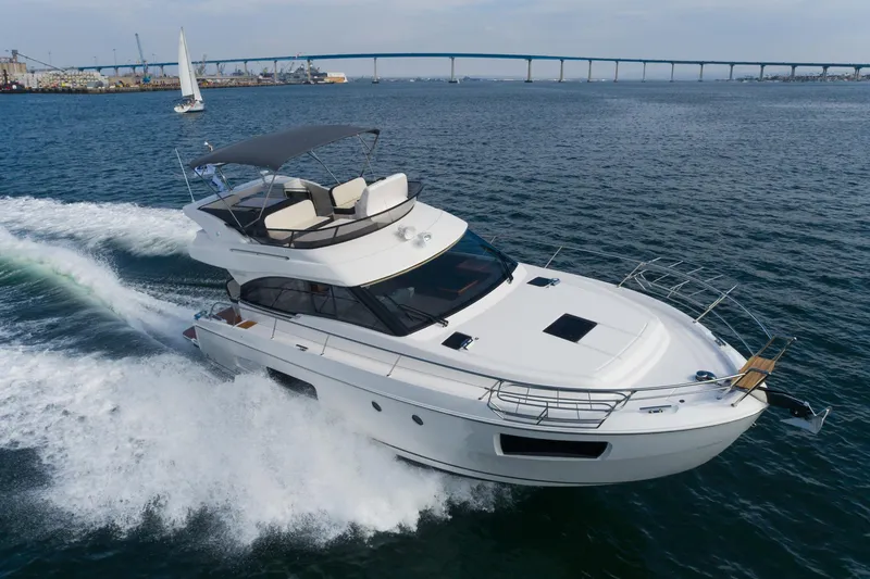 Slide: The Image of 2025 Bavaria Virtess 420 Fly yacht cruising on open water. - 18