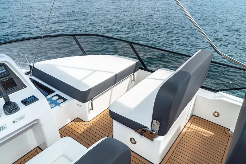 Slide: The Image of 2025 Bavaria Virtess 420 Fly yacht deck with seating and ocean view. - 27