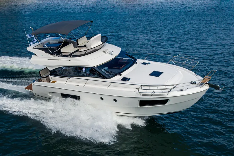 Slide: The Image of 2025 Bavaria Virtess 420 Fly yacht cruising on open water. - 3