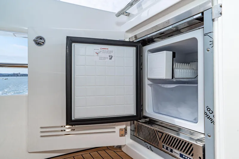 Slide: The Image of Open freezer on Bavaria Virtess 420 Fly yacht, 2025 model, with ice tray visible. - 30