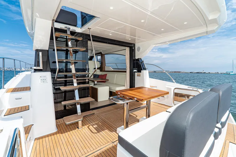 Slide: The Image of Luxurious Bavaria Virtess 420 Fly yacht interior, 2025 model, featuring elegant wood finishes and modern design. - 33