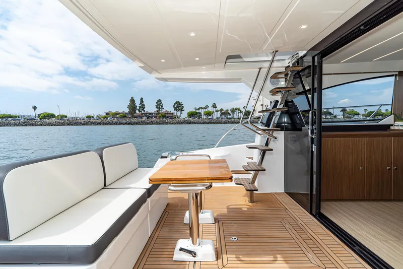 Slide: The Image of Luxurious Bavaria Virtess 420 Fly yacht deck with seating, table, and ocean view, 2025 model. - 36