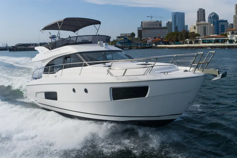 Slide: The Image of 2025 Bavaria Virtess 420 Fly yacht cruising near city skyline. - 5