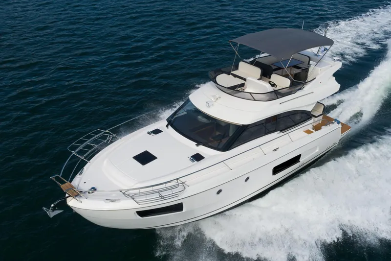 Slide: The Image of 2025 Bavaria Virtess 420 Fly yacht cruising on open water. - 7
