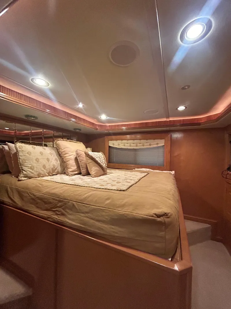 Slide: The Image of Luxurious bedroom interior of a 2004 Fantasy Houseboat with cozy lighting and elegant bedding. - 14