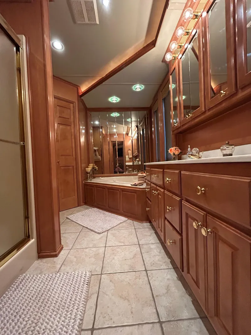 Slide: The Image of Luxurious 2004 Fantasy houseboat bathroom with wooden cabinetry and elegant lighting. - 29