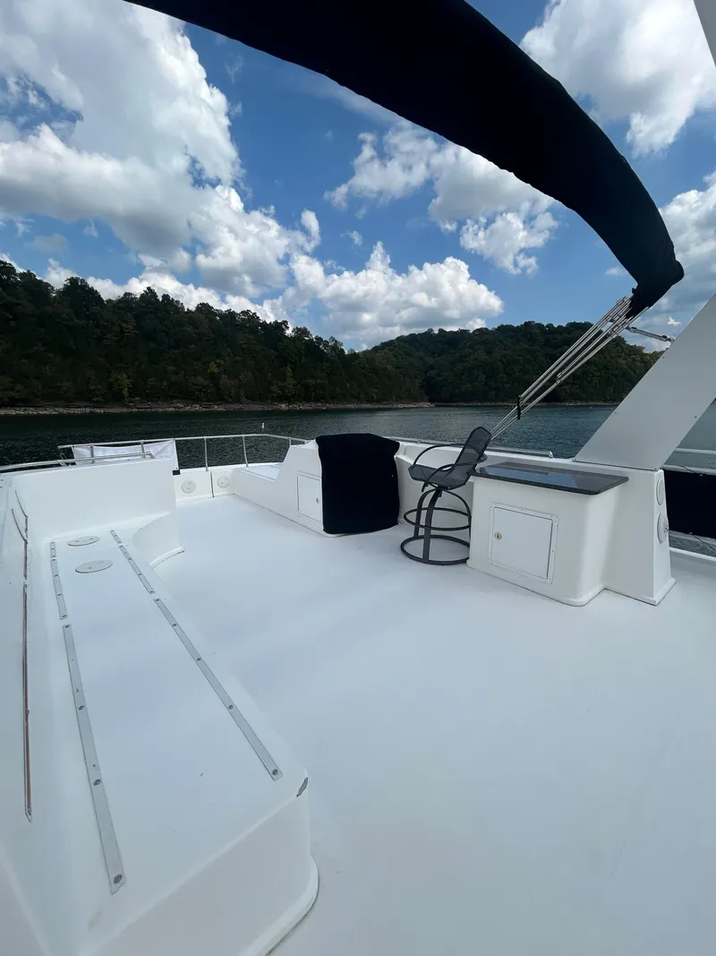 Slide: The Image of Spacious deck of 2004 Fantasy houseboat with scenic lake and forest views. - 33