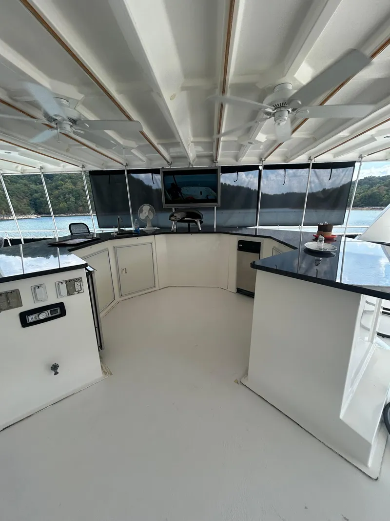 Slide: The Image of Spacious 2004 Fantasy houseboat interior with modern kitchen and scenic lake view. - 37