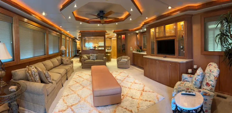 Slide: The Image of Luxurious 2004 Fantasy houseboat interior with elegant furnishings, cozy seating, and modern entertainment area. - 4