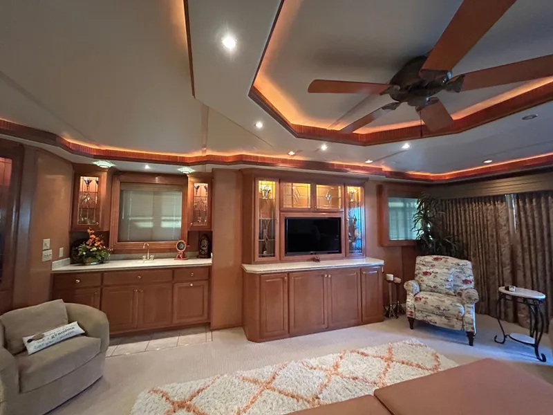 Slide: The Image of Luxurious 2004 Fantasy houseboat interior with elegant lighting, cozy seating, and modern entertainment center. - 6