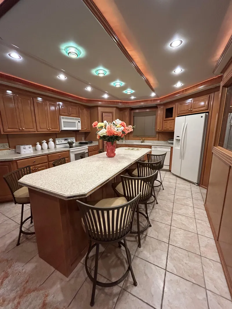 Slide: The Image of Luxurious kitchen in a 2004 Fantasy houseboat with modern appliances and elegant decor. - 8